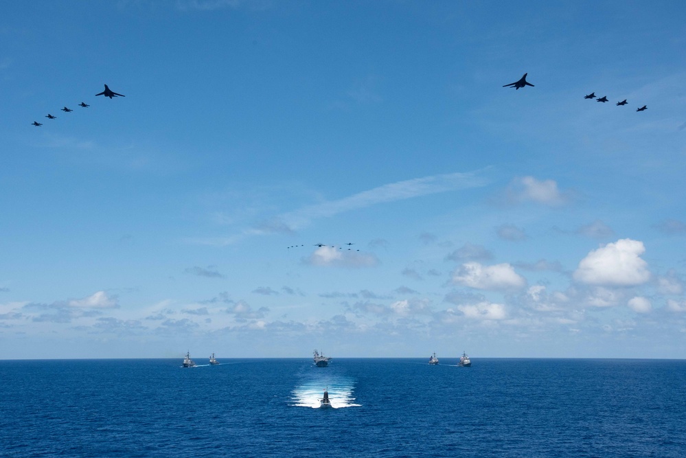 USS Ronald Reagan (CVN 76) steams in formation with 7th Fleet ships, Japan Maritime Self-Defense Force ships, as U.S. Navy, U.S. Air Force and Japan Air Self-Defense Force aircraft fly over in support of Valiant Shield 2024