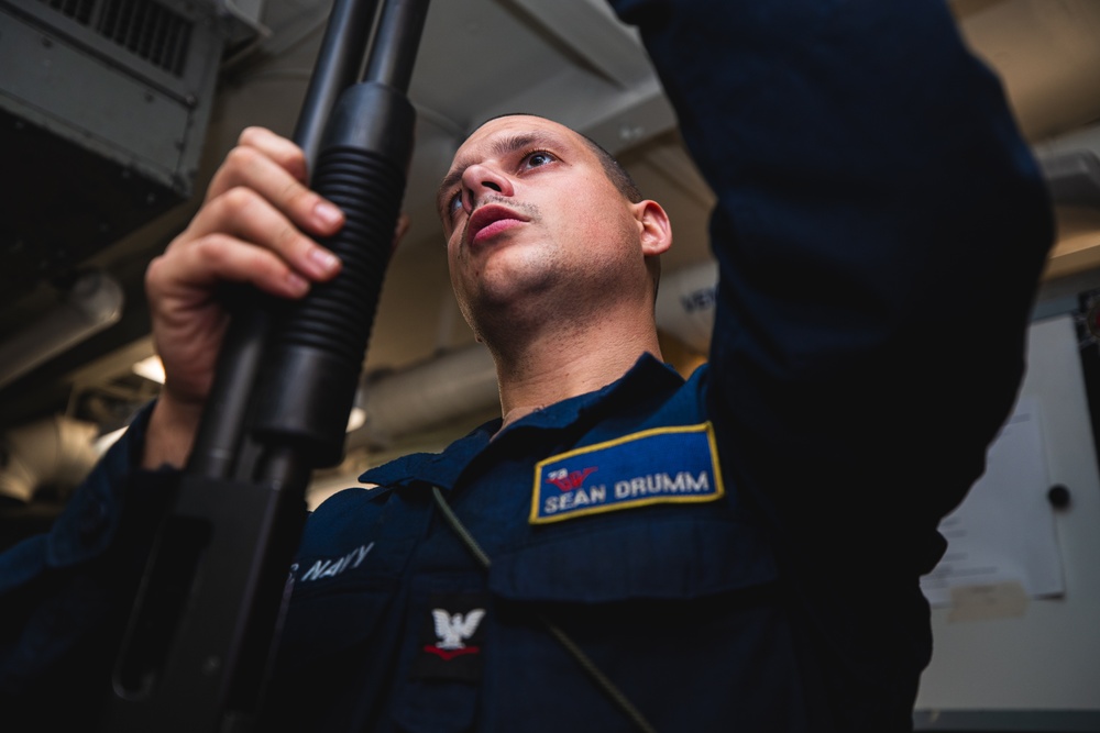 USS George Washington Sailors perform weapon assembly