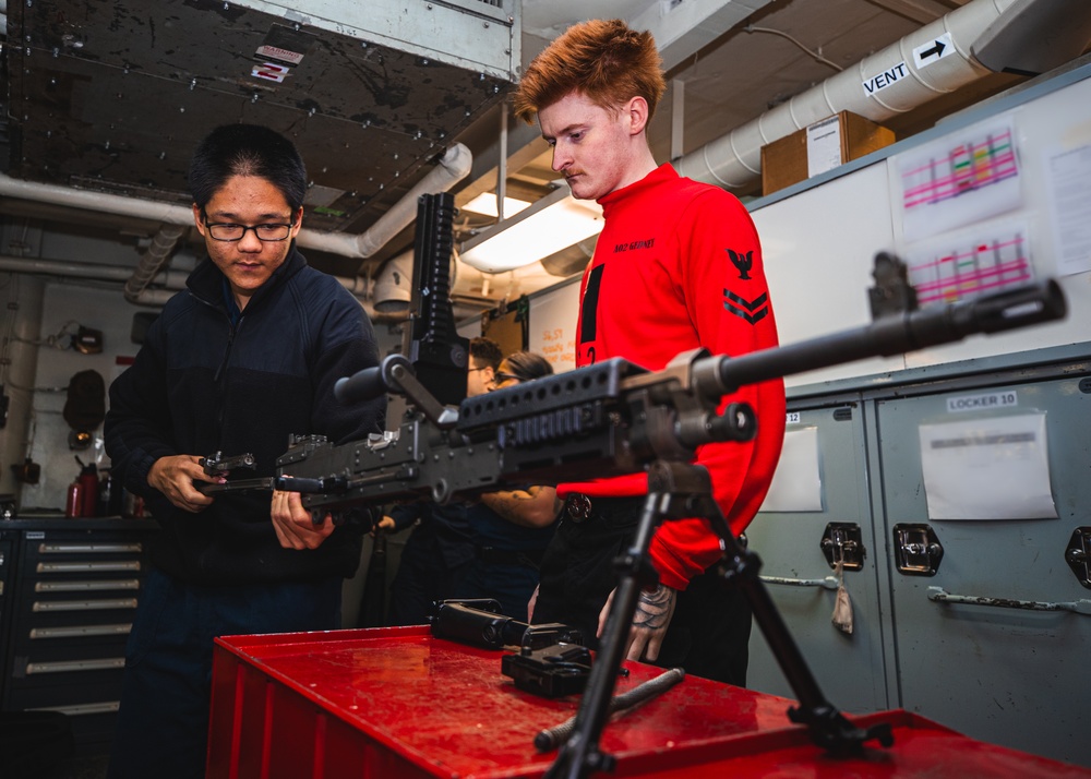 USS George Washington Sailors perform weapon assembly