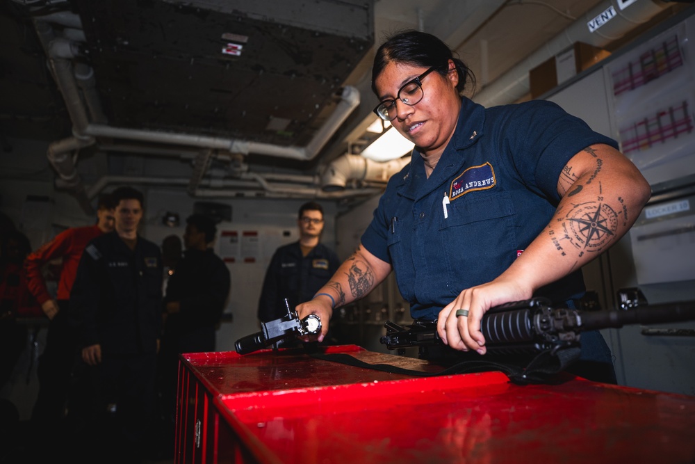 USS George Washington Sailors perform weapon assembly