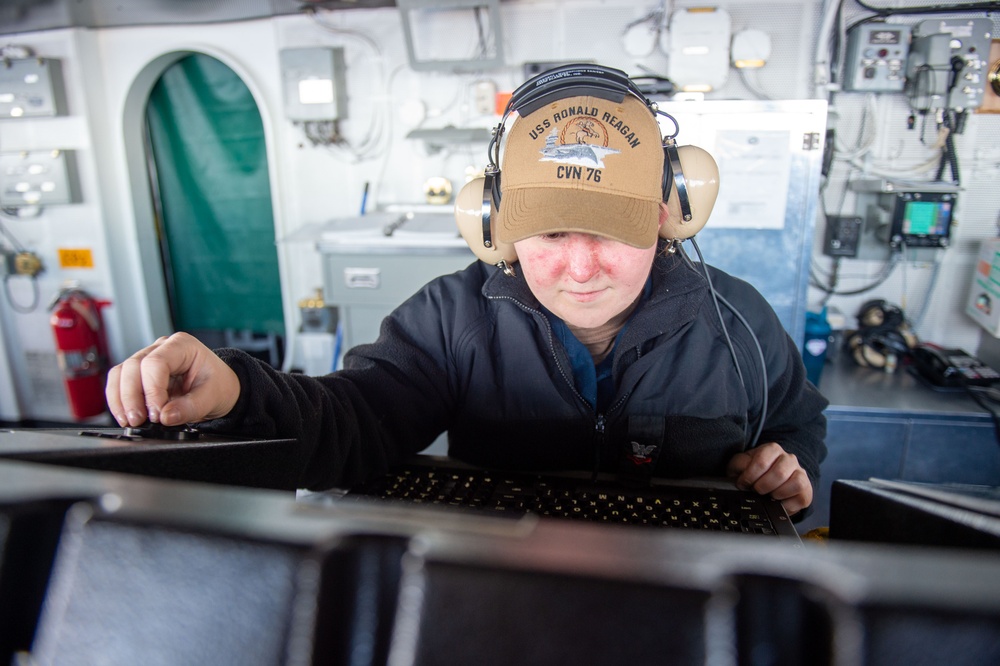 USS Ronald Reagan (CVN 76) Sailors stand watch in the pilot house