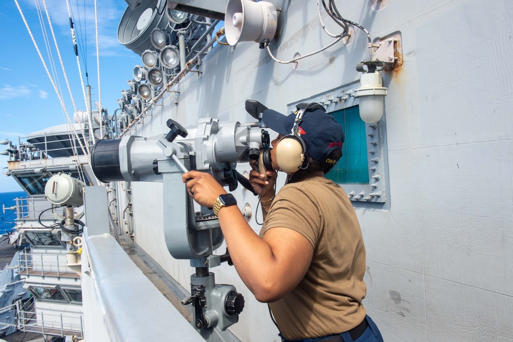 USS Ronald Reagan (CVN 76) Sailors stand watch in the pilot house