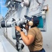 USS Ronald Reagan (CVN 76) Sailors stand watch in the pilot house