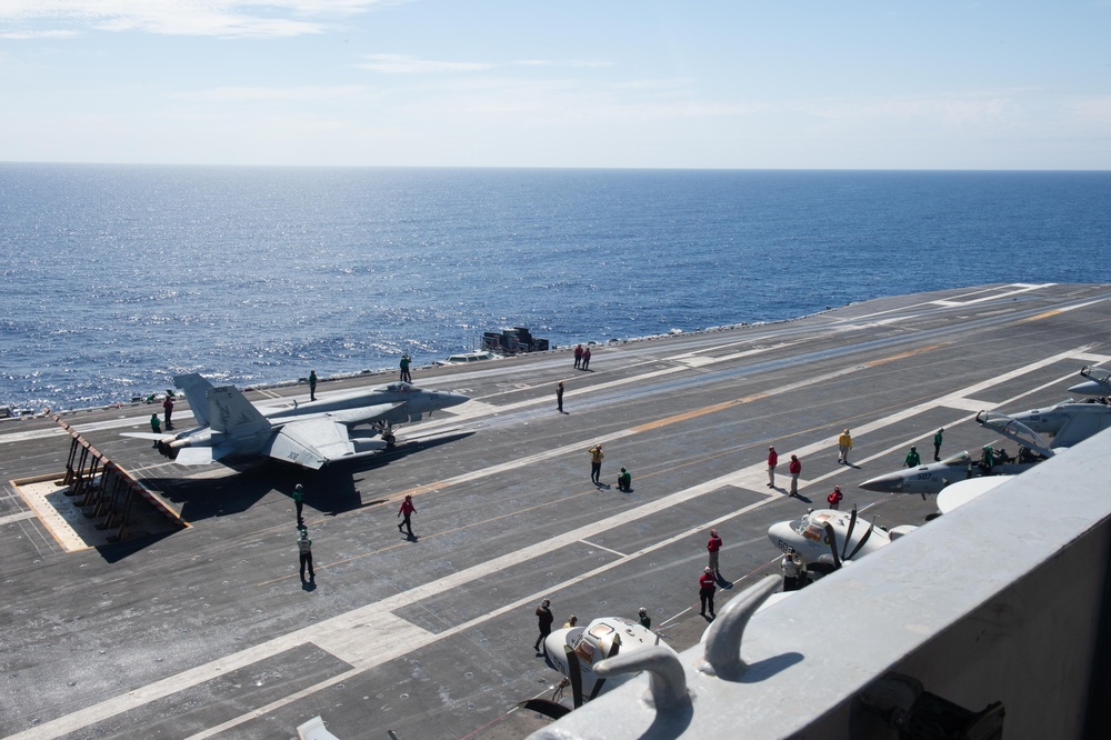 USS Ronald Reagan (CVN 76) Sailors stand watch in the pilot house