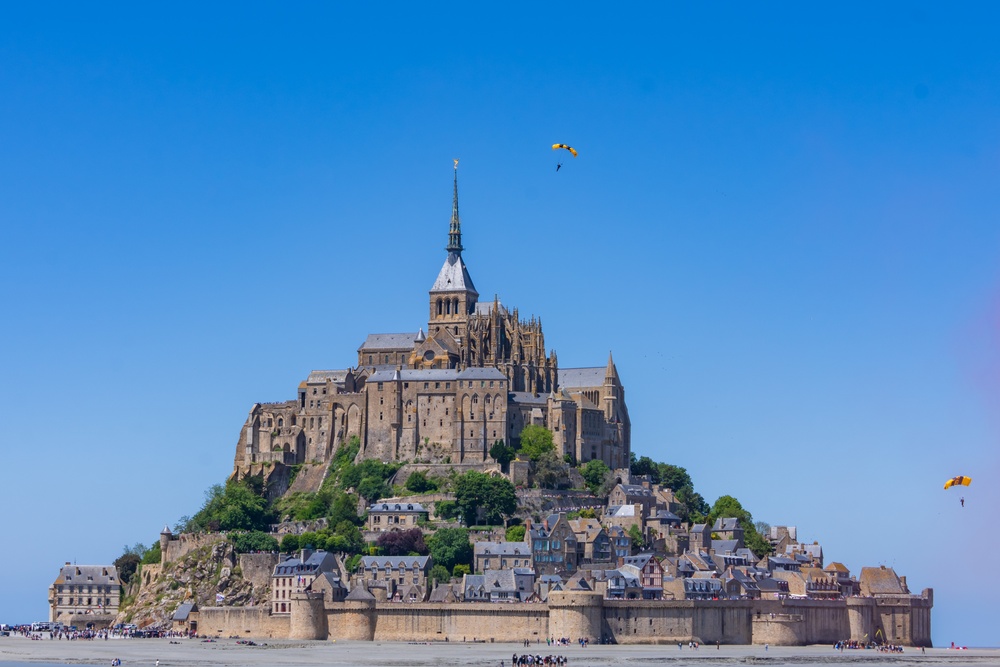 Soldiers from Army Golden Knights jump at Mont Saint- Michel Normandy, France for D-Day commemoration ceremonies