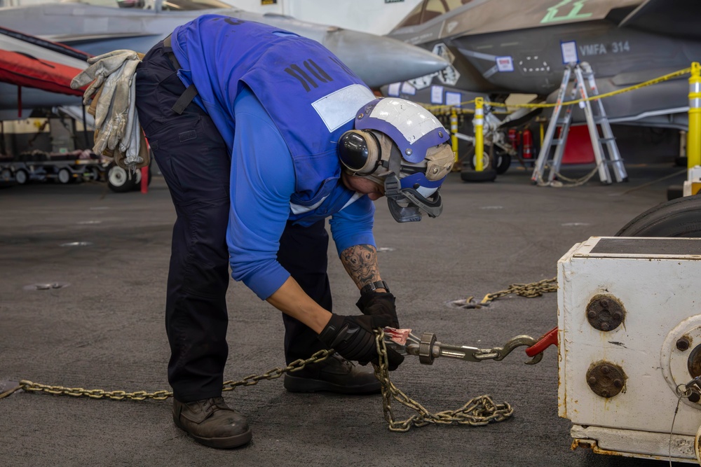 Sailor conducts maintenance aboard Abraham Lincoln