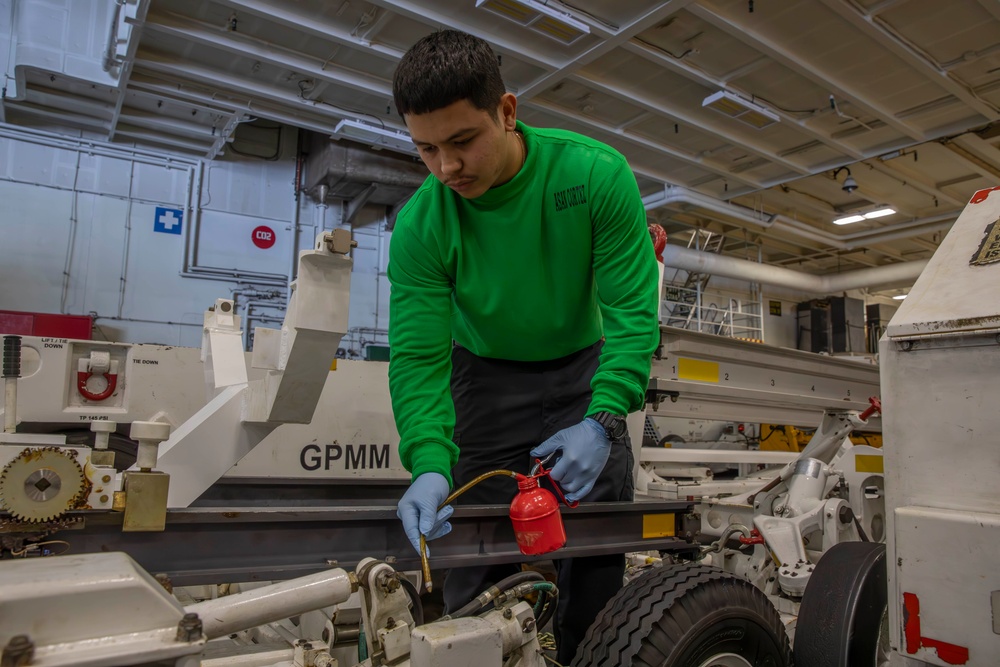 Sailor conducts maintenance aboard Abraham Lincoln