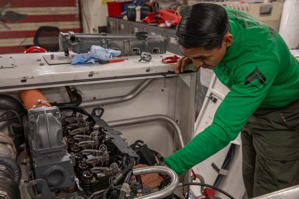 Marine conducts maintenance aboard Abraham Lincoln