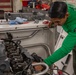 Marine conducts maintenance aboard Abraham Lincoln