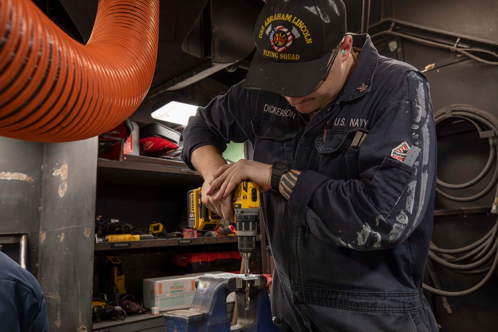 DVIDS - Images - Sailor drills metal aboard Abraham Lincoln [Image 3 of 5]