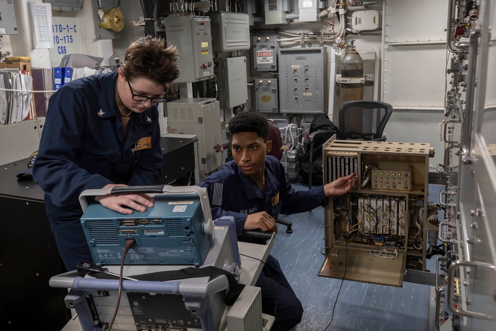 Sailors conduct electrical maintenance aboard Abraham Lincoln