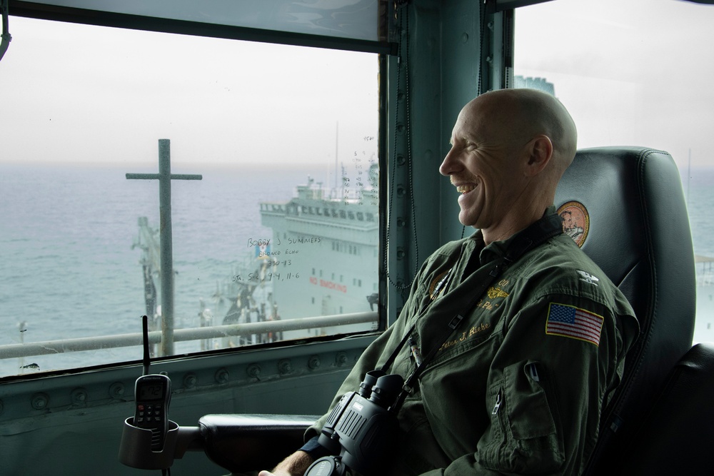 Capt. Pete Riebe oversees Abraham Lincoln replenishment at sea