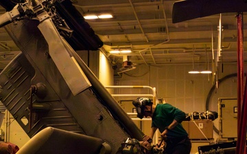 Sailors conduct aviation maintenance aboard Abraham Lincoln