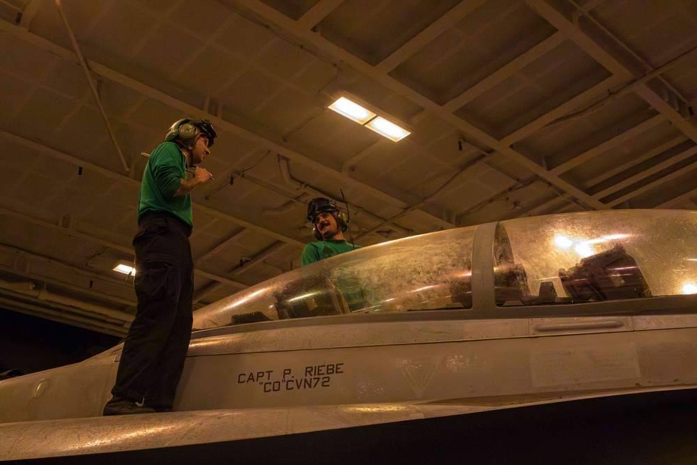 Sailors conduct aviation maintenance aboard Abraham Lincoln