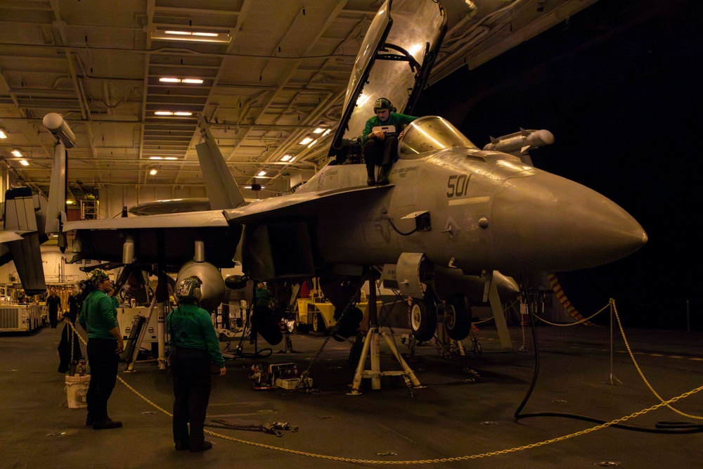 Sailors conduct aviation maintenance aboard Abraham Lincoln