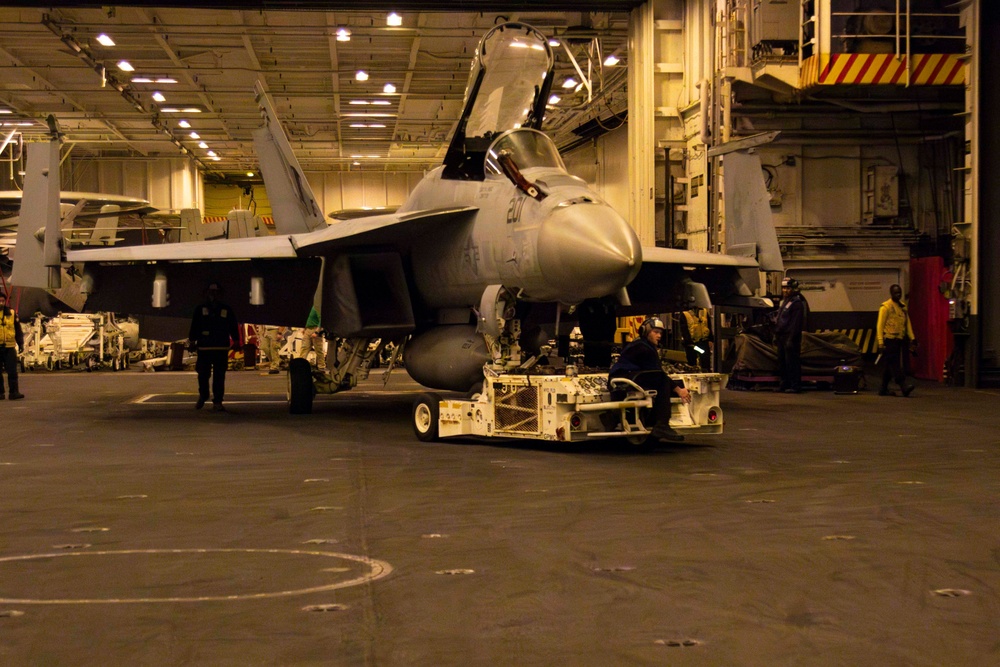 Sailors conduct aviation maintenance aboard Abraham Lincoln