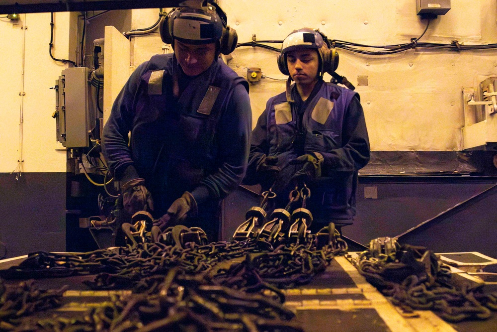 Sailors conduct aviation maintenance aboard Abraham Lincoln