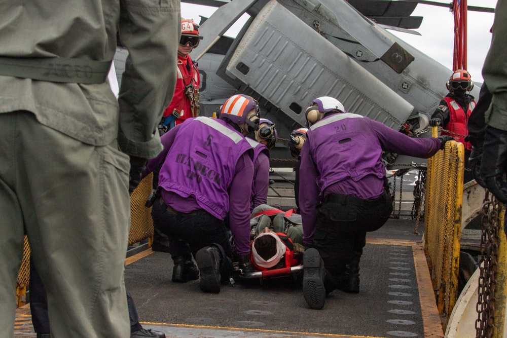 Sailors participate in a medical emergency drill aboard Abraham Lincoln