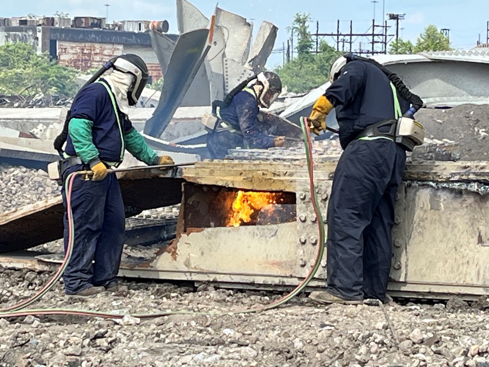 Workers carve up steel wreckage at Sparrows Point, as Unified Command nears restoration of Baltimore's Federal Channel