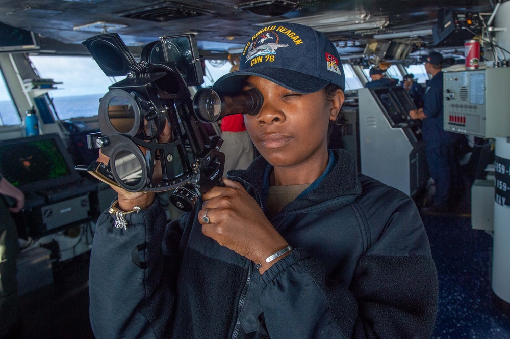 USS Ronald Reagan (CVN 76) Sailors stand watch in the pilot house