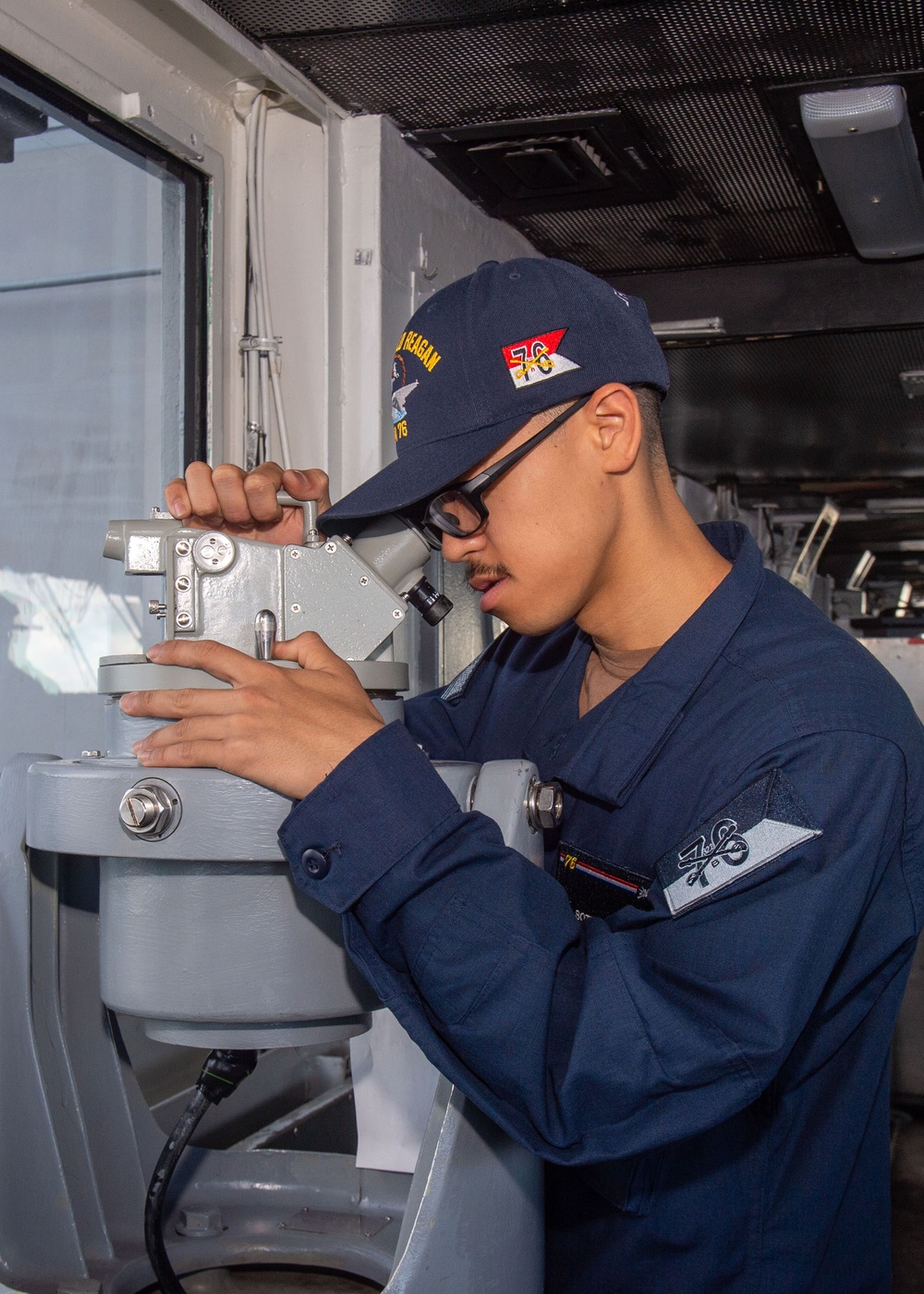 USS Ronald Reagan (CVN 76) Sailors stand watch in the pilot house