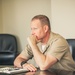 Rear Adm. Greg Huffman Introduces Rear Adm. Brent DeVore to Congressman Moylan in Guam
