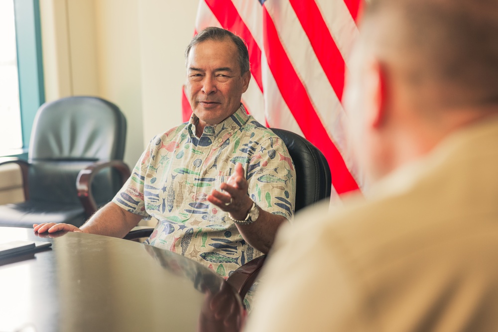 Rear Adm. Greg Huffman Introduces Rear Adm. Brent DeVore to Congressman Moylan in Guam