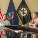 Rear Adm. Greg Huffman Introduces Rear Adm. Brent DeVore to Congressman Moylan in Guam