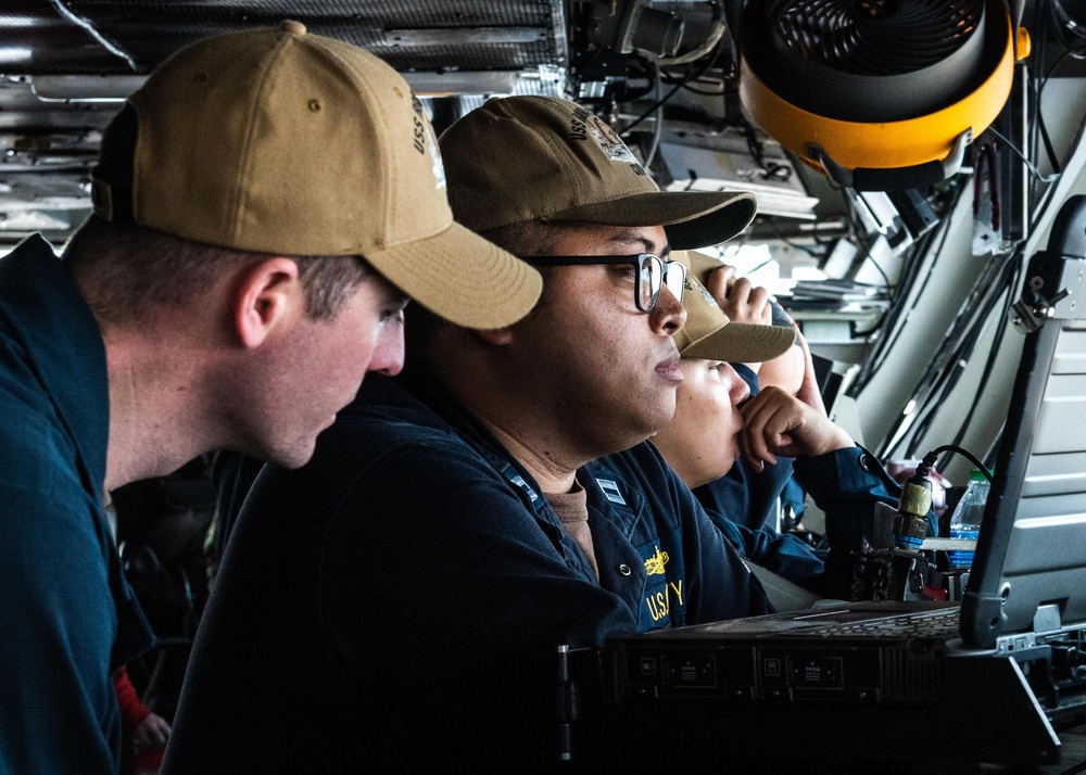 USS Ronald Reagan (CVN 76) Sailors stand watch in the  pilot house