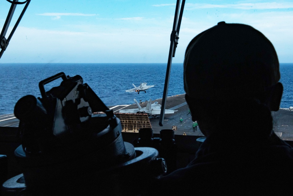 USS Ronald Reagan (CVN 76) Sailors stand watch in the  pilot house