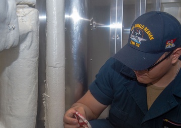 USS Ronald Reagan (CVN 76) Sailors conduct  routine maintenance