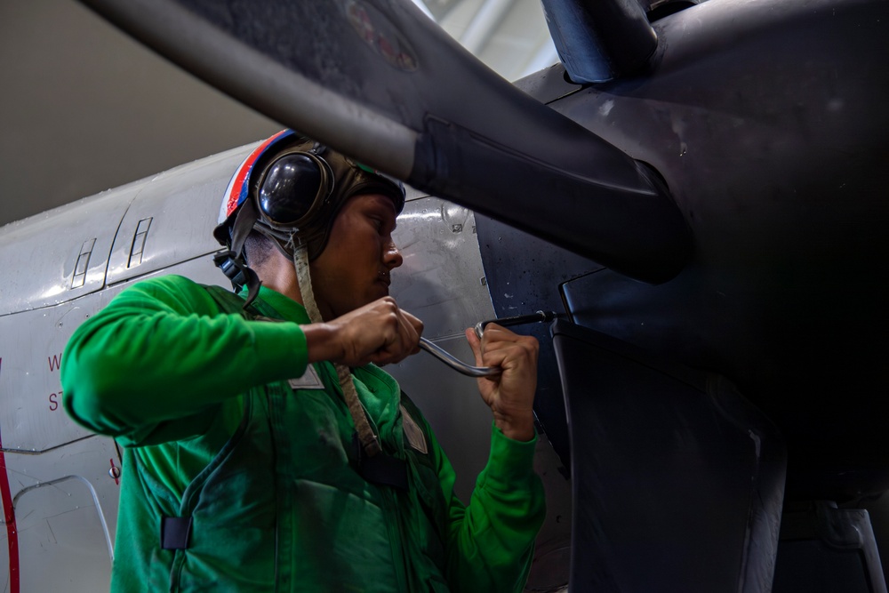 Sailor conducts routine maintenance aboard Abraham Lincoln