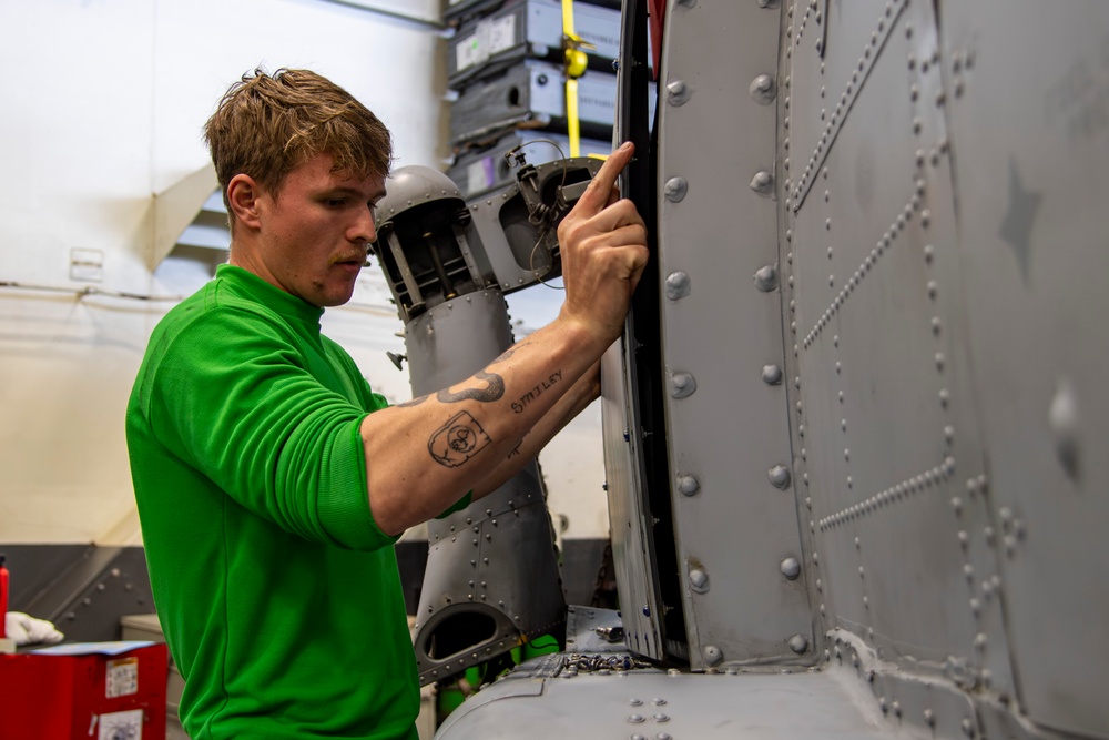 Sailor conducts routine maintenance aboard Abraham Lincoln