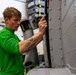Sailor conducts routine maintenance aboard Abraham Lincoln