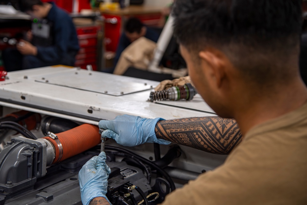 Sailor conducts routine maintenance aboard Abraham Lincoln