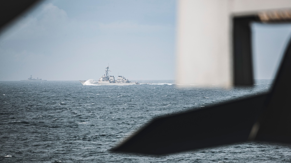 USS Porter Passes by the George Washington