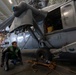 Sailor prepares to transport helicopter aboard Abraham Lincoln