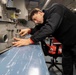 Sailor conducts maintenance aboard Abraham Lincoln
