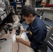 Sailor conducts maintenance aboard Abraham Lincoln