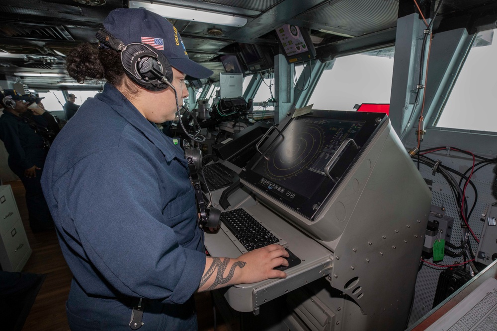 Sailor stands watch aboard Abraham Lincoln