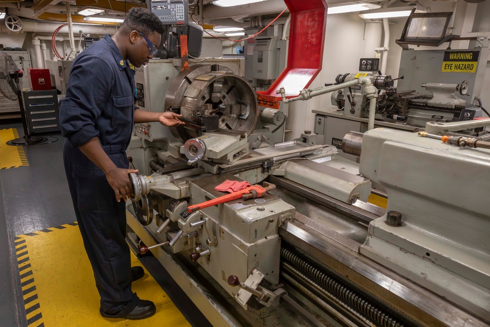 Sailor conducts maintenance aboard Abraham Lincoln