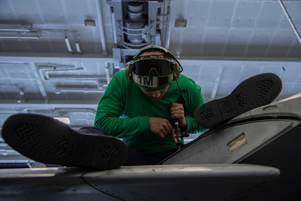 Sailor conducts maintenance aboard Abraham Lincoln