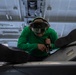Sailor conducts maintenance aboard Abraham Lincoln