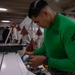 Marine conducts maintenance aboard Abraham Lincoln