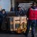Sailors assigned to the USS America (LHA 6) particpates in a ordnance handling evolution