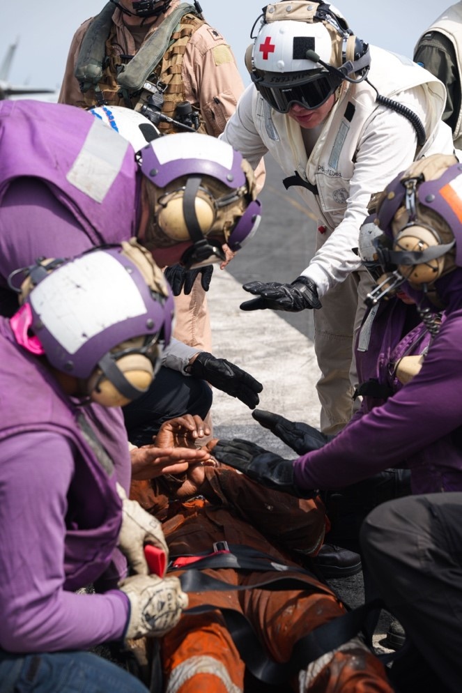 Headline: USS Dwight D. Eisenhower (CVN 69) Conducts Rescue Operations in the Red Sea