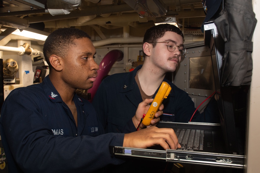 USS Ronald Reagan (CVN 76) Sailors troubleshoot communications tower