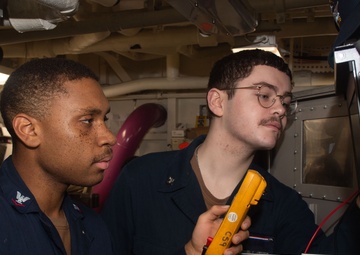USS Ronald Reagan (CVN 76) Sailors troubleshoot communications tower
