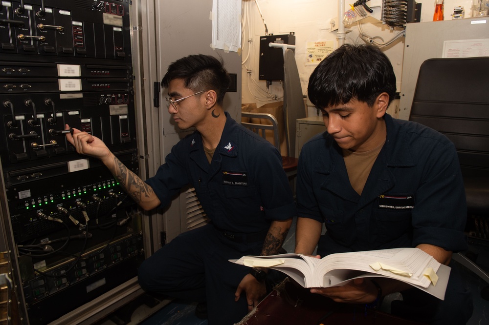 USS Ronald Reagan (CVN 76) Sailors troubleshoot communications tower