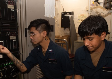 USS Ronald Reagan (CVN 76) Sailors troubleshoot communications tower